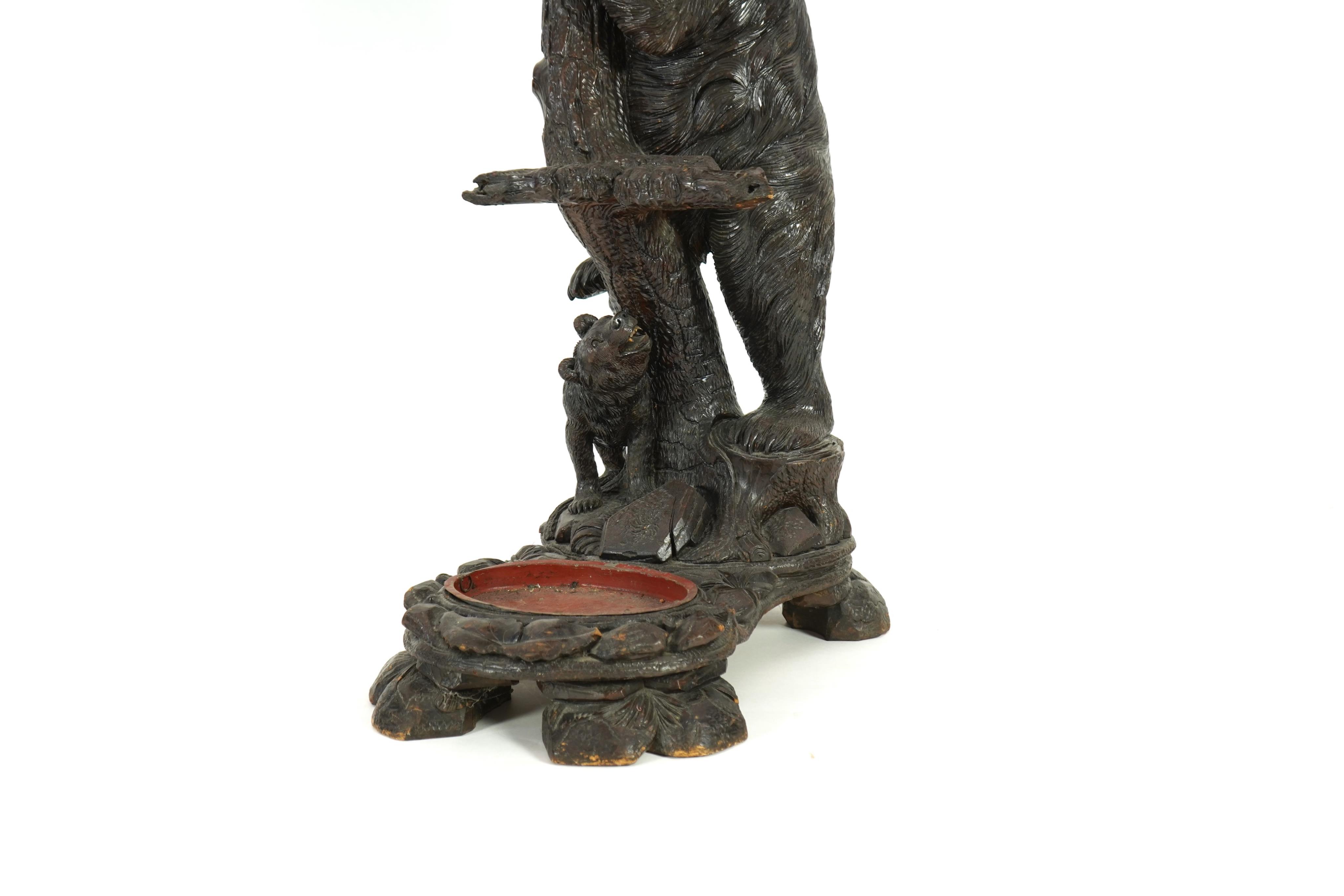 A late 19th century Black forest carved bear hallstand